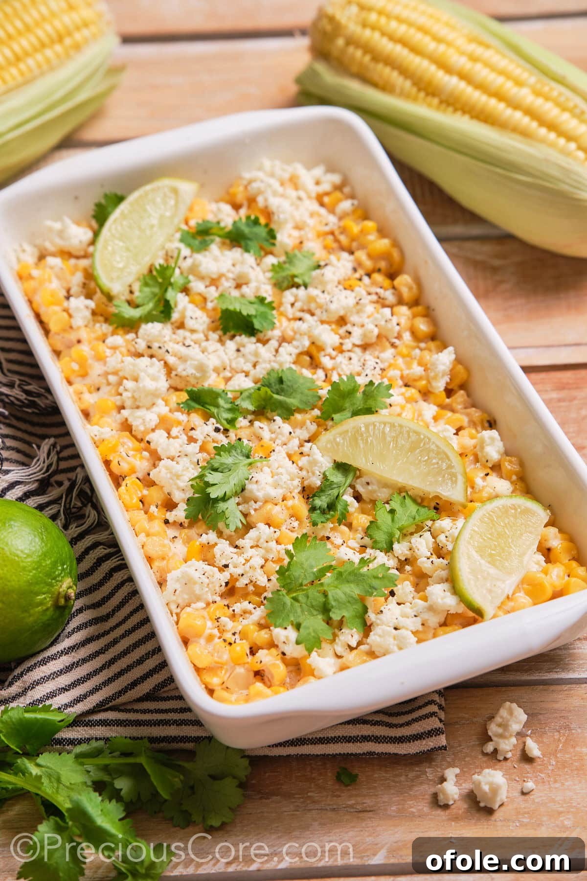 Fiesta Street Corn Bake 2 A delectable Street Corn Casserole presented in an elegant white baking dish, garnished and ready to serve.