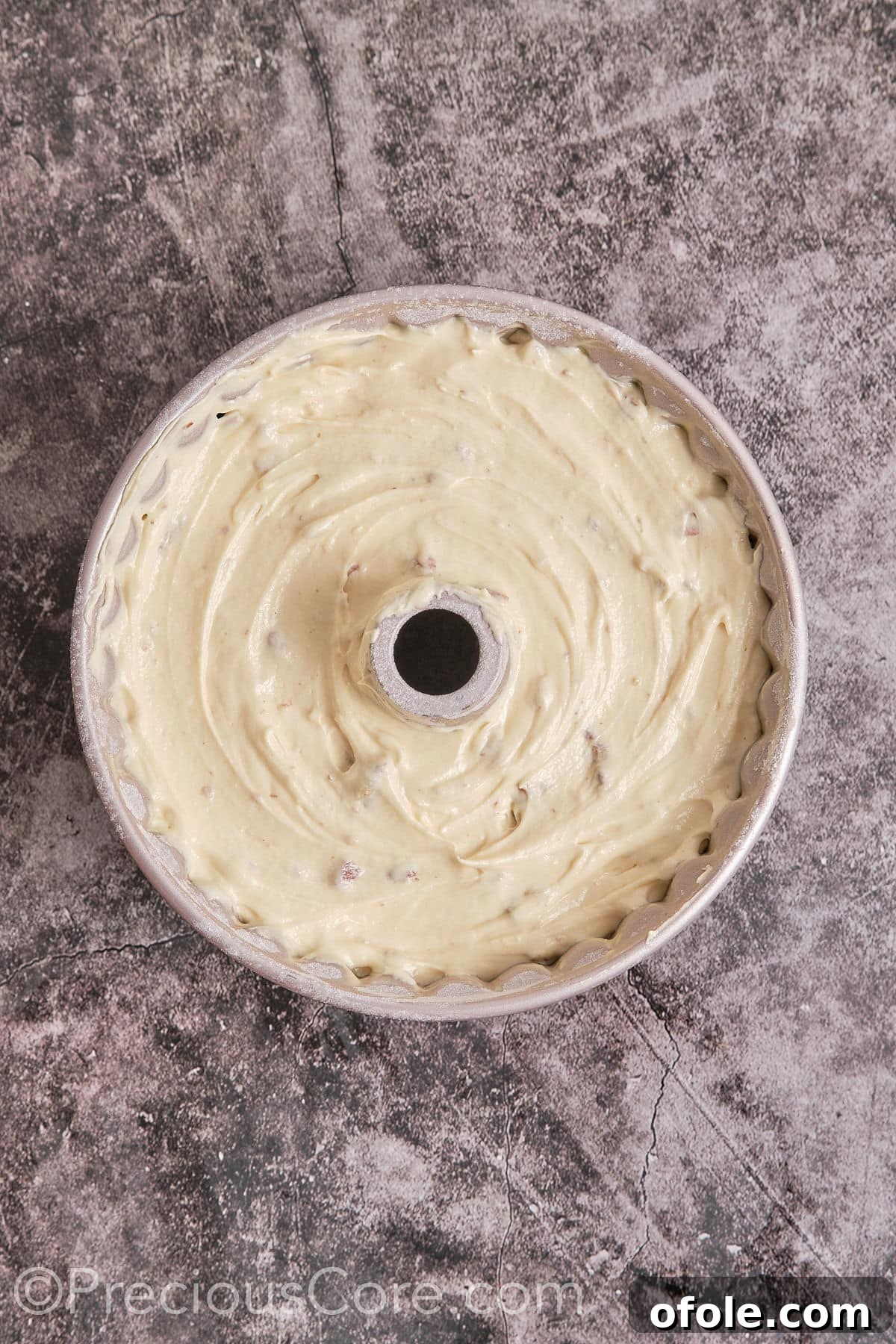 Southern Butter Pecan Pound Cake 11 Pouring the smooth cake batter into a prepared Bundt pan.
