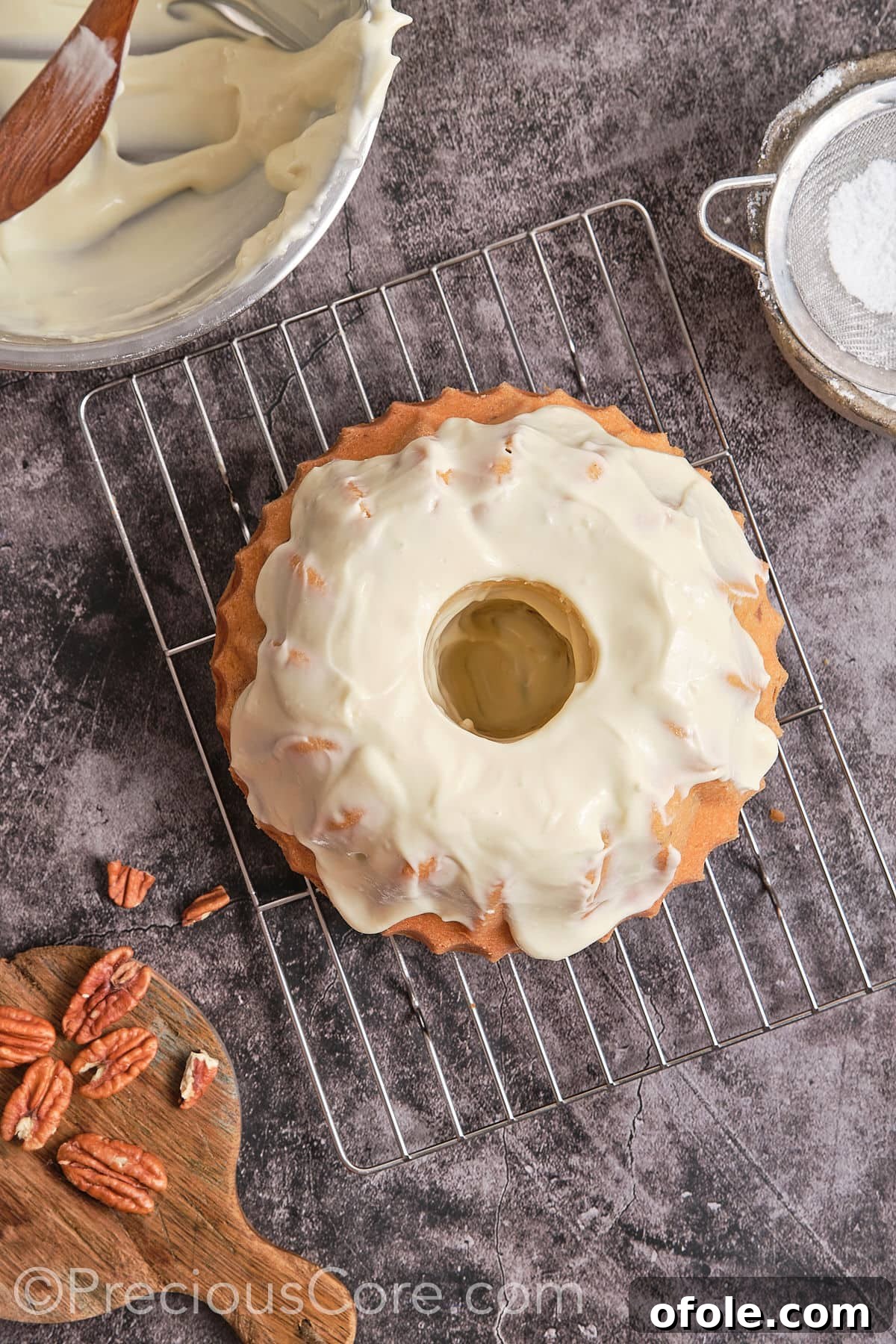 Southern Butter Pecan Pound Cake 16 Spreading cream cheese frosting over the cooled butter pecan pound cake.