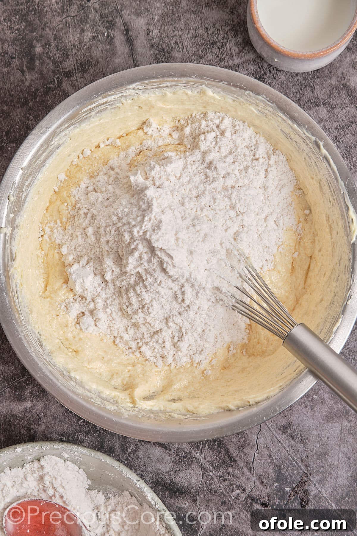 Southern Butter Pecan Pound Cake 9 Adding flour mixture gradually to the wet ingredients and mixing until just combined.