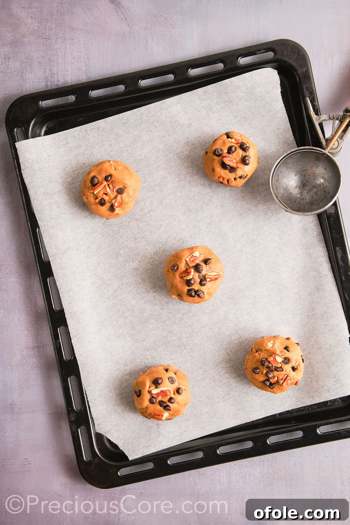 Decadent Brown Butter Pecan Delights 14 Cookie dough balls neatly scooped onto a prepared baking sheet, perfectly spaced and ready for the oven.