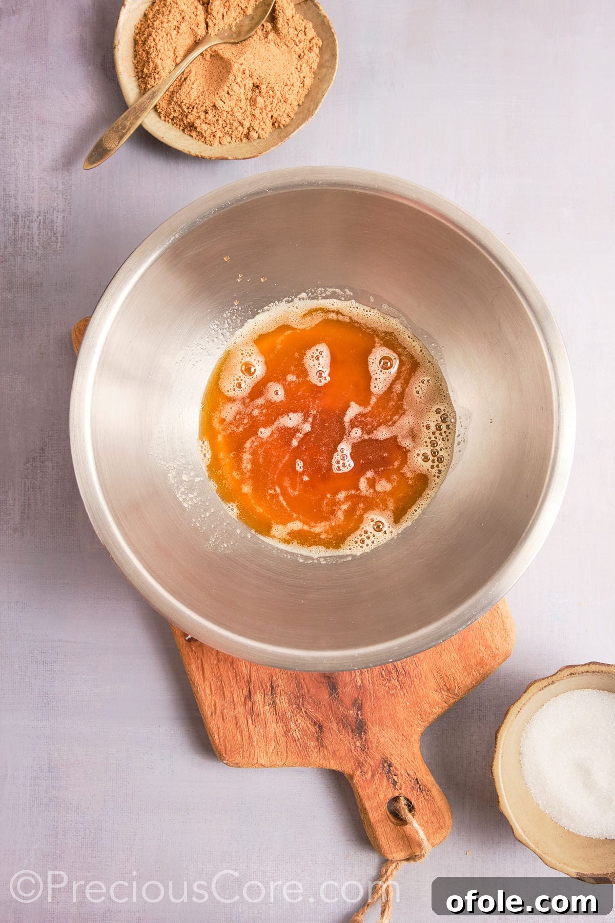 Decadent Brown Butter Pecan Delights 8 Brown butter in a large mixing bowl, visually in the process of cooling down.