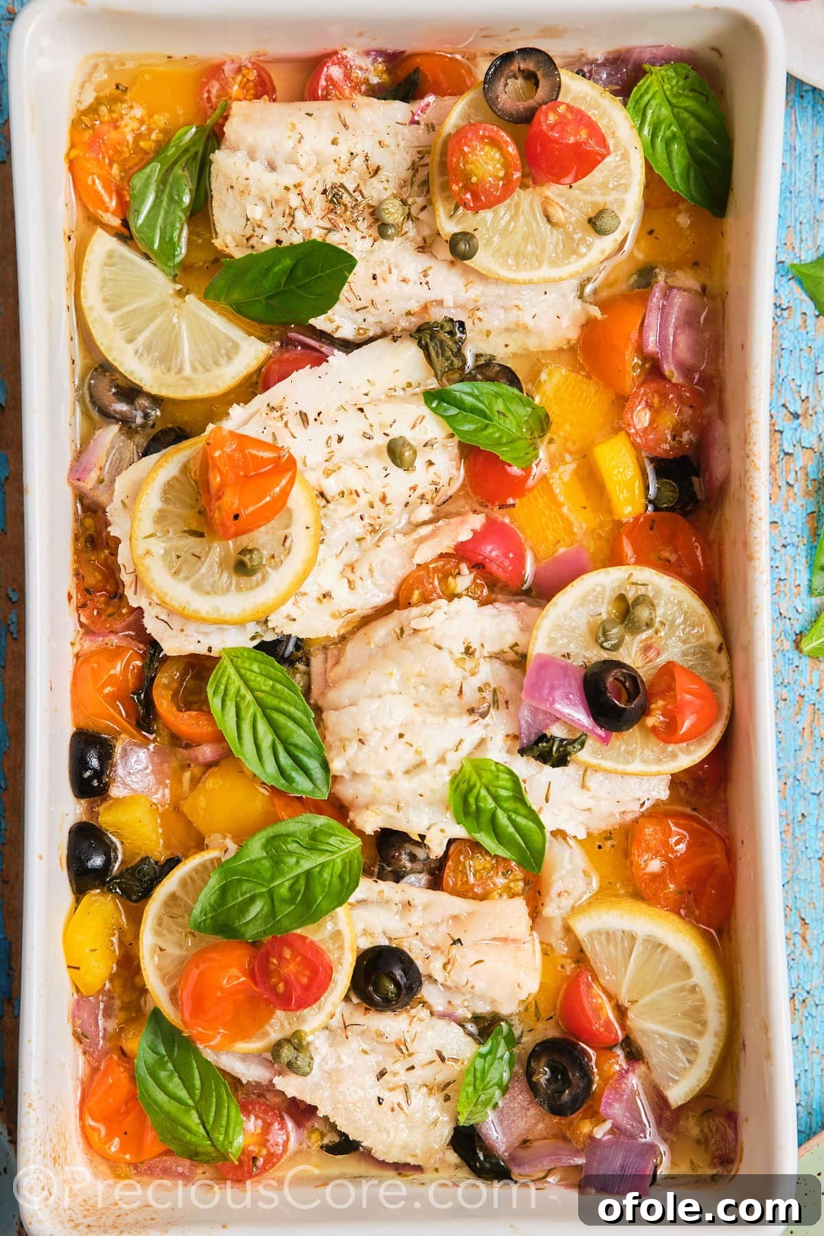 Vibrant Mediterranean Baked Fish 2 baking dish with Mediterranean baked fish.