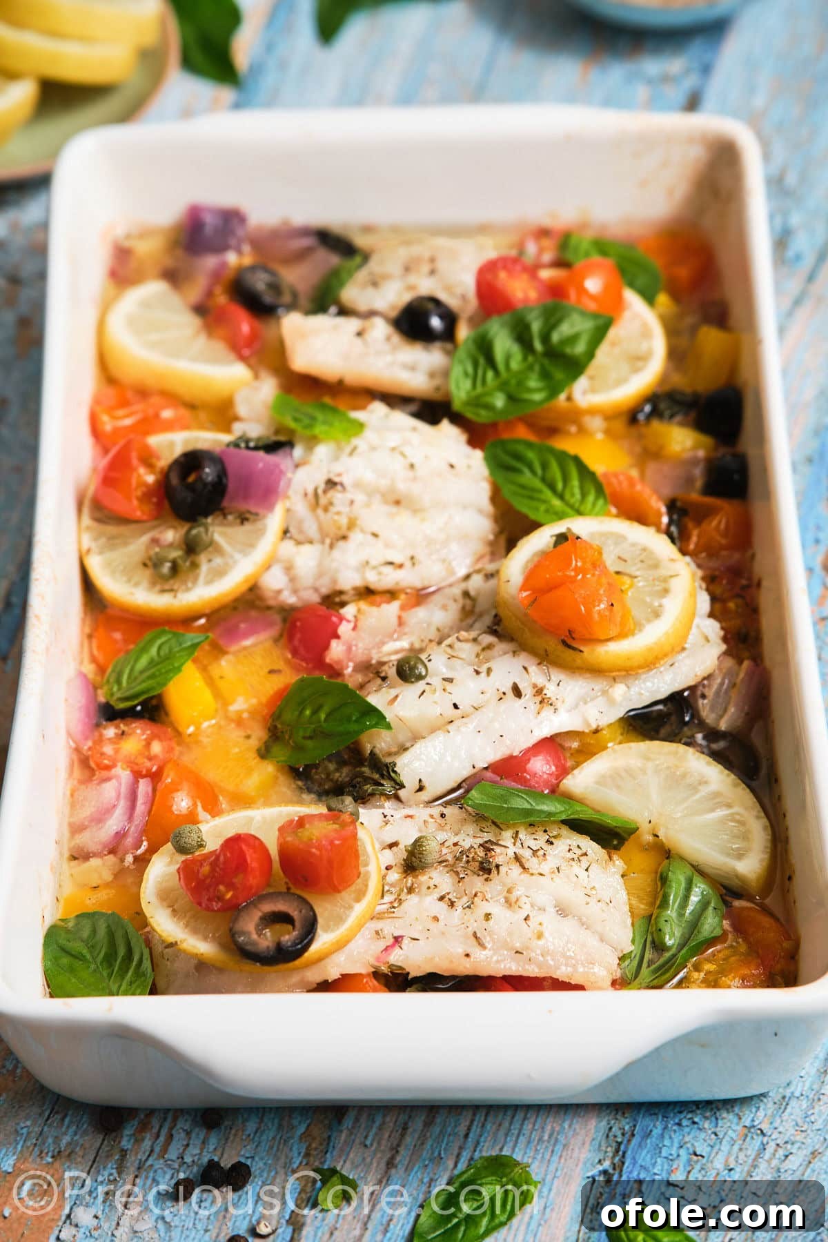 Vibrant Mediterranean Baked Fish 10 Closeup of baked Mediterranean fish in a pan.