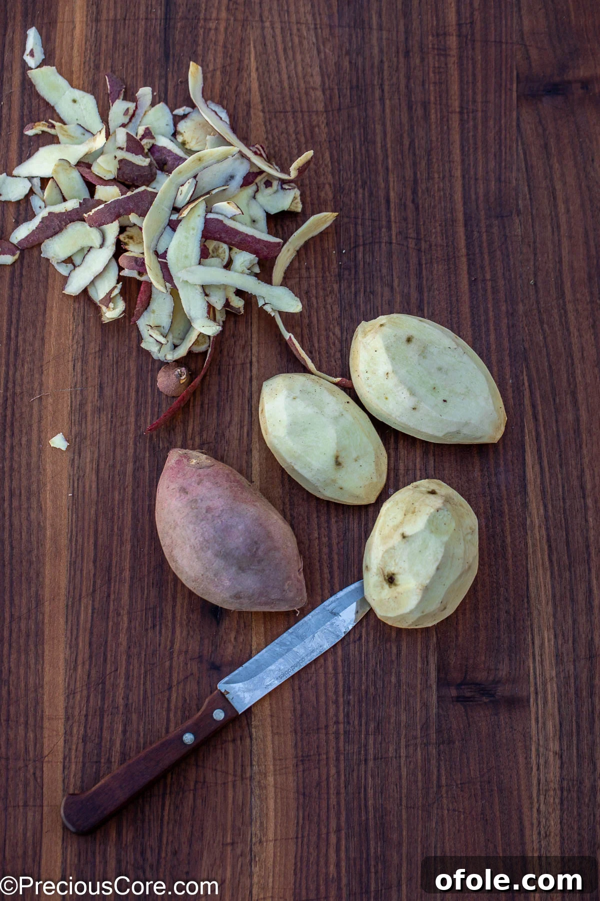 Velvety White Sweet Potato Puree 6 Peeling white sweet potatoes on a cutting board.