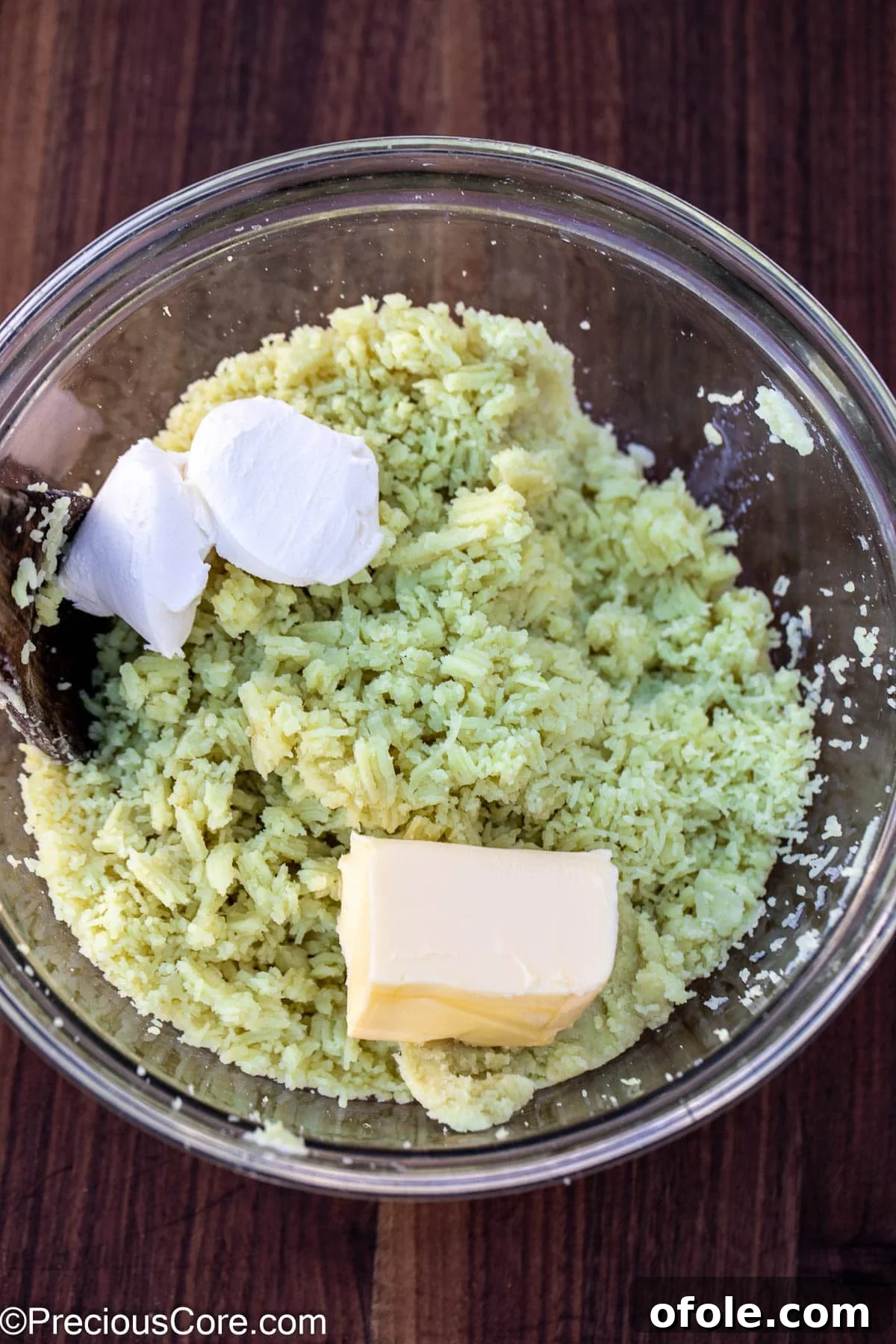 Velvety White Sweet Potato Puree 10 Adding butter, milk, and cream cheese to mashed potatoes.