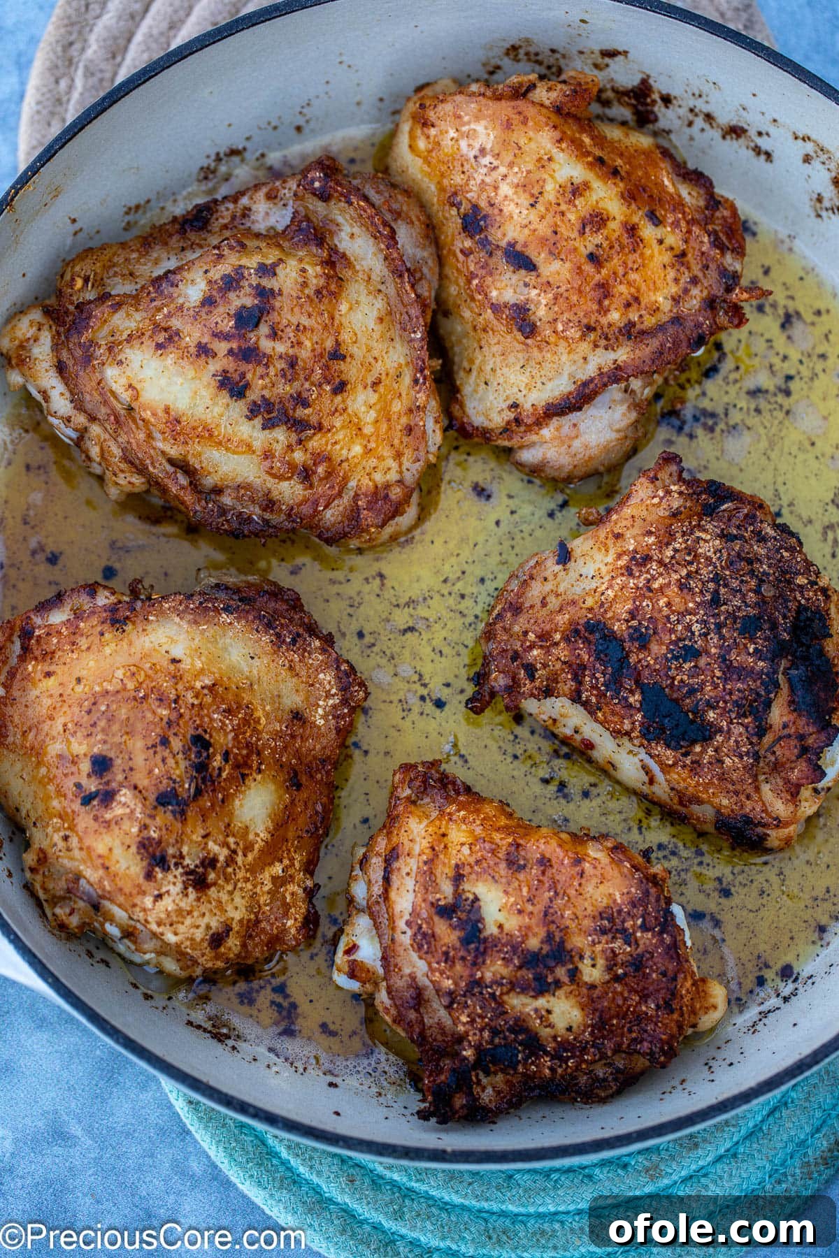 Savory One-Pot Chicken Thighs and Rice 6 Marinated chicken thighs searing in a hot pan, developing a beautiful golden crust.