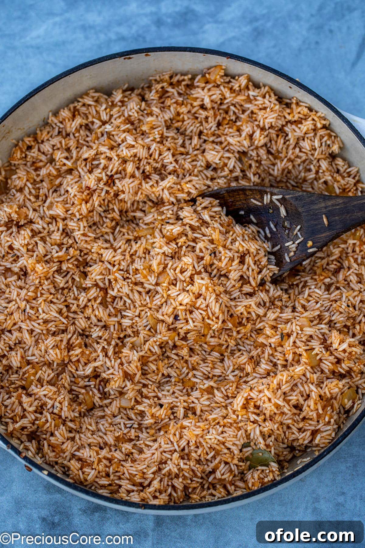 Savory One-Pot Chicken Thighs and Rice 9 Jasmine rice being sautéed and toasted with the aromatic mixture in the pot.