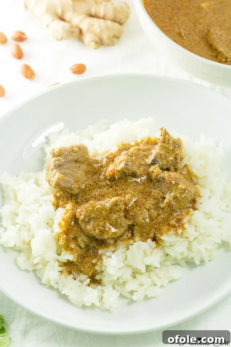 Cameroonian Groundnut Soup served with rice, a classic pairing