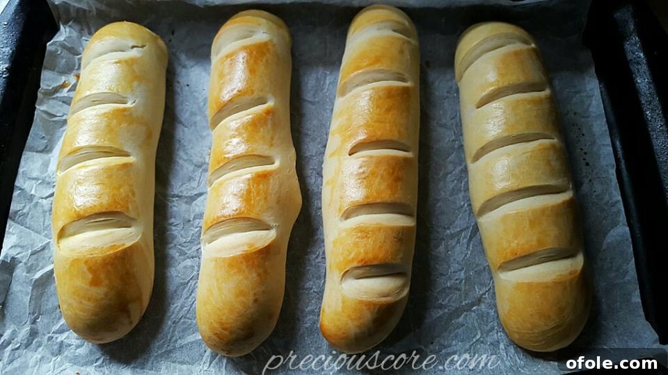 Essential Solitude 4 Delicious pain au lait, or homemade milk bread, on a cooling rack.