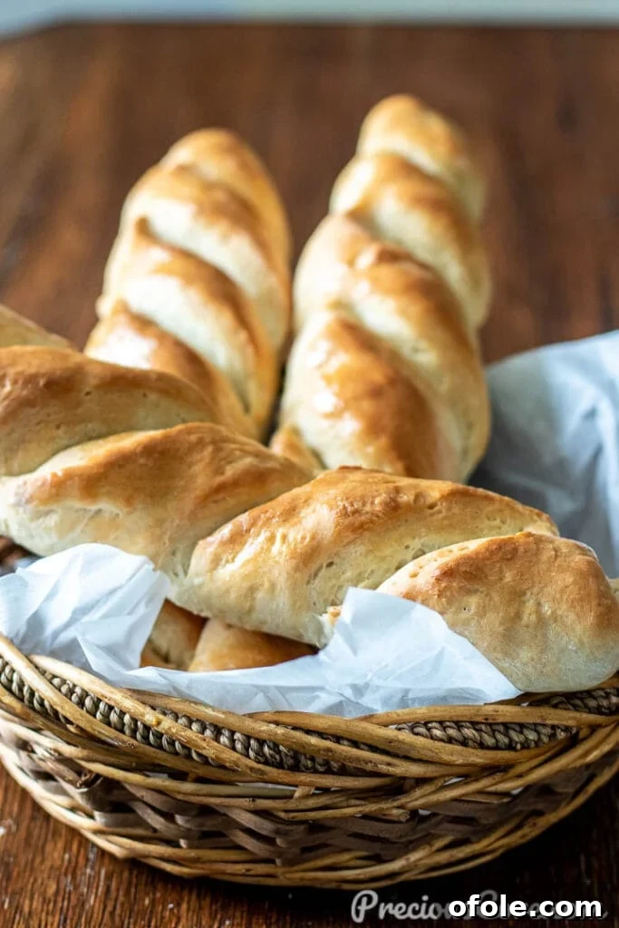 Effortless Crusty French Loaves 2 Homemade French Bread in a rustic basket, showcasing its golden crust and inviting texture