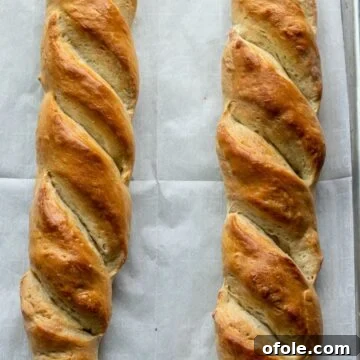 Freshly baked homemade French bread on baking sheet