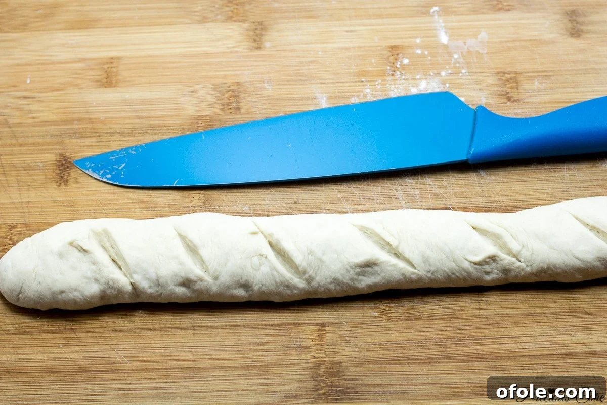 Effortless Crusty French Loaves 10 A French bread loaf with beautiful diagonal scores across its surface