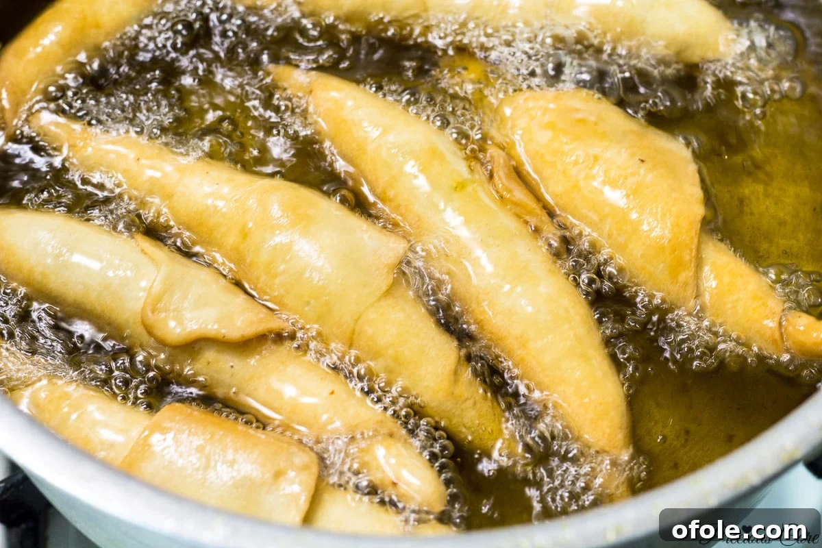 Freshly fried golden brown Cameroonian fish rolls