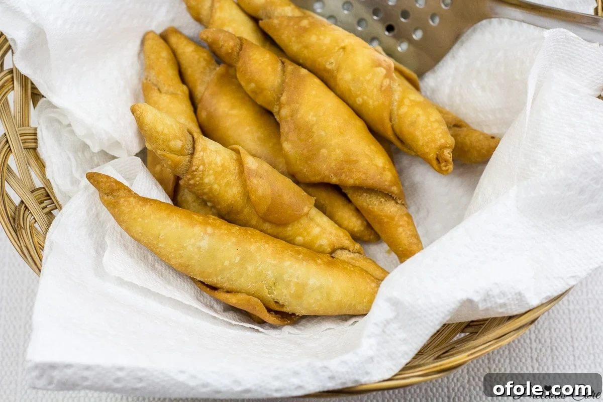 Drained Cameroonian fish rolls on paper towels