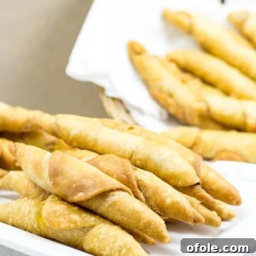 Plate and basket of Cameroonian fish rolls.
