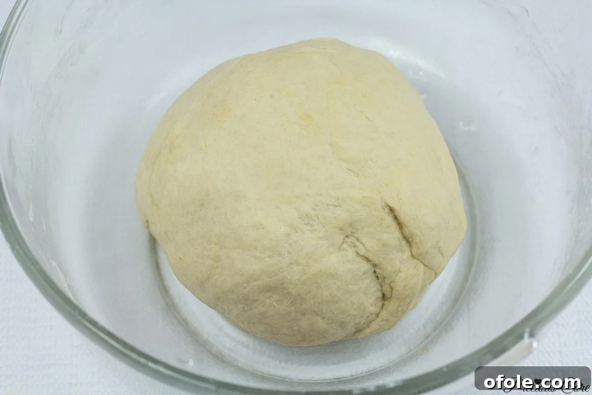 Mixing dough ingredients for Cameroonian fish rolls