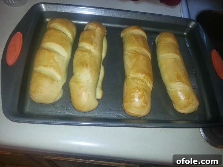 Baked Golden Milk Bread Loaves Freshly baked golden brown milk bread loaves out of the oven.