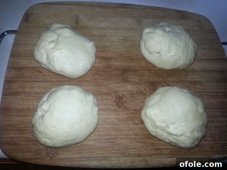 Divided Milk Bread Dough Portions Milk bread dough divided into four equal portions.