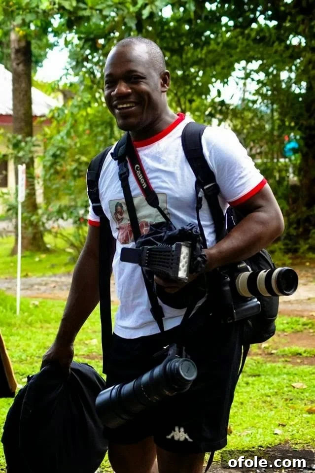 Penjo Baba capturing moments with his camera, demonstrating passion for photography
