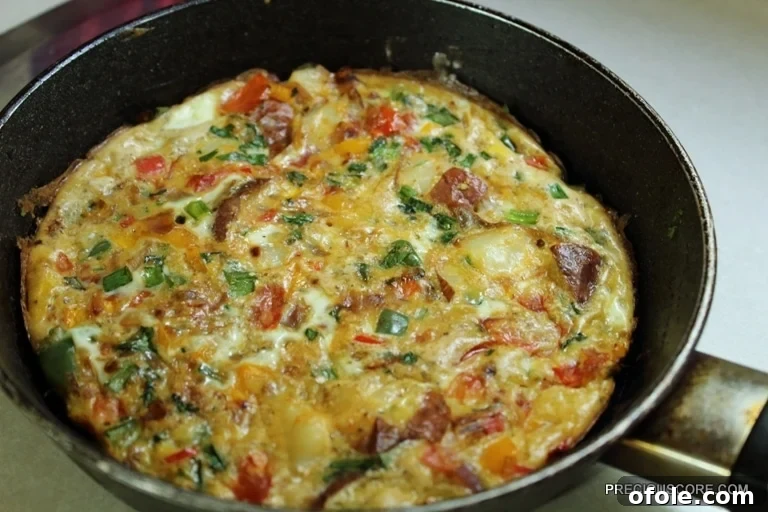 Hearty Breakfast Frittata 11 Freshly baked frittata hot out of the oven in a skillet, perfectly golden