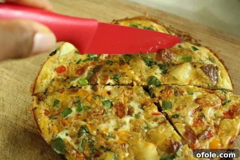 Hearty Breakfast Frittata 14 A close-up of a delicious frittata wedge, showcasing the vegetables inside