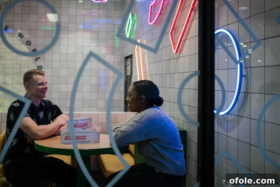 17 Next-Level Rizz Lines for Her 2 Man and woman sitting in store, laughing together