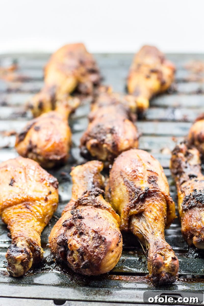 Perfectly oven-grilled chicken, golden brown and crispy, resting on a baking sheet.