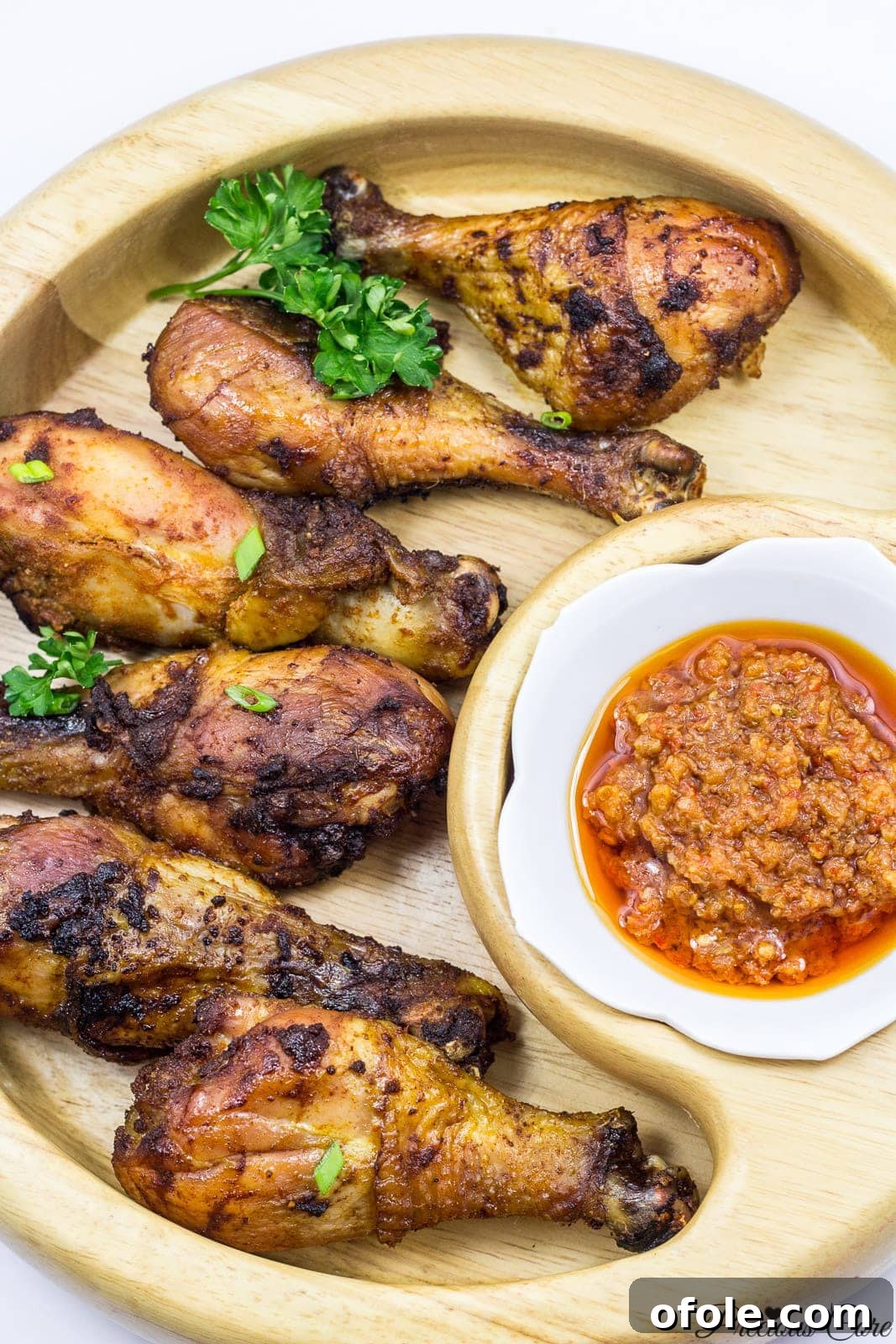 Close-up of perfect oven-grilled chicken, showcasing its crispy skin and succulent texture, ready to be served.