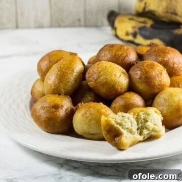 Plantain puff puffs on a white plate.