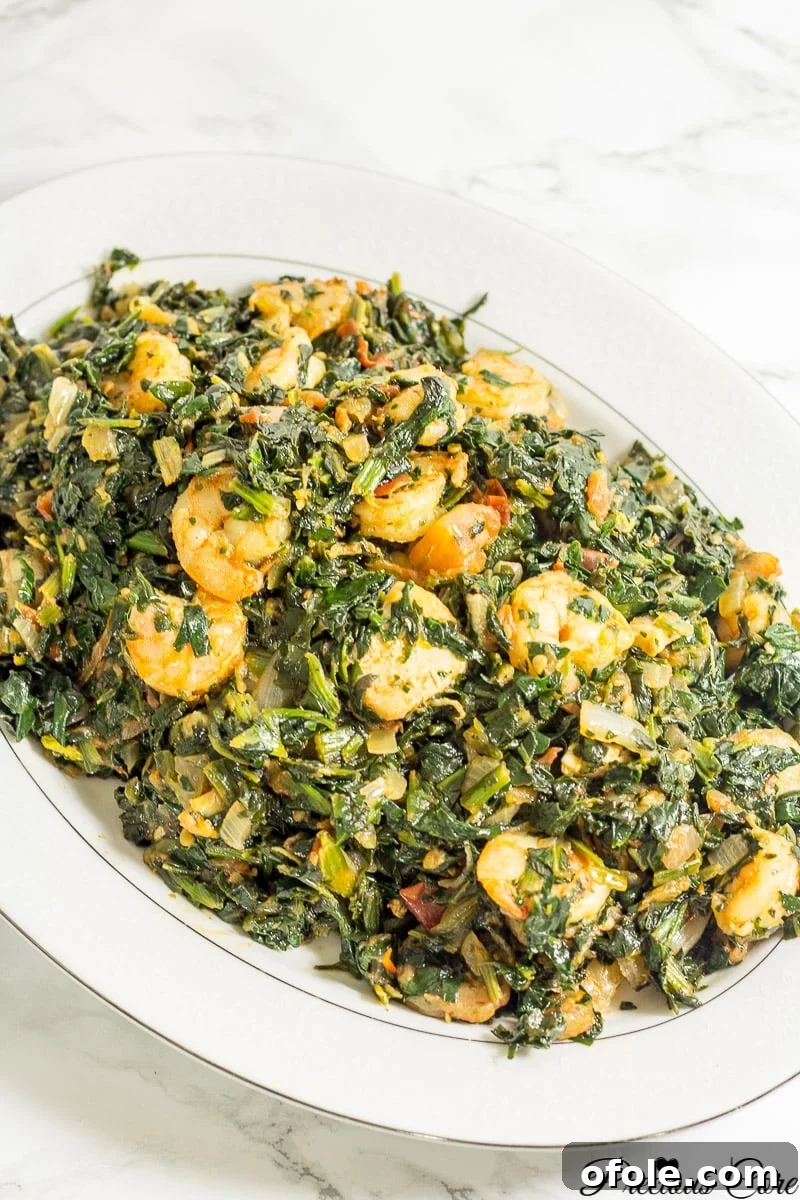 Vibrant African Spinach Stew with Chicken and Shrimp 3 Traditional Cameroonian Spinach Stew preparation