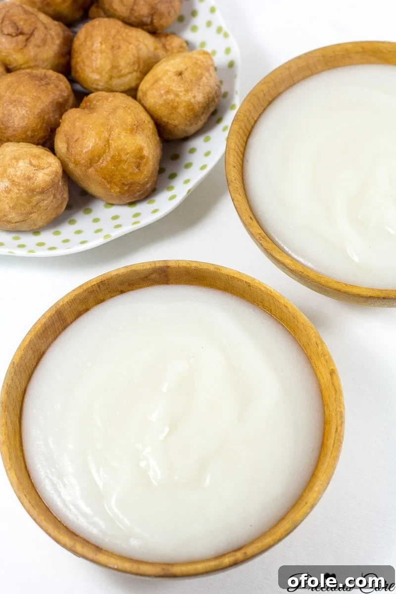 Ingredients for making pap, including corn flour, water, and essential kitchen tools like a sieve and mixing bowl.