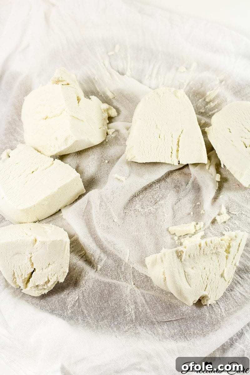 Raw fermented corn paste (pap) wrapped in a kitchen cloth, ready for squeezing and preservation.