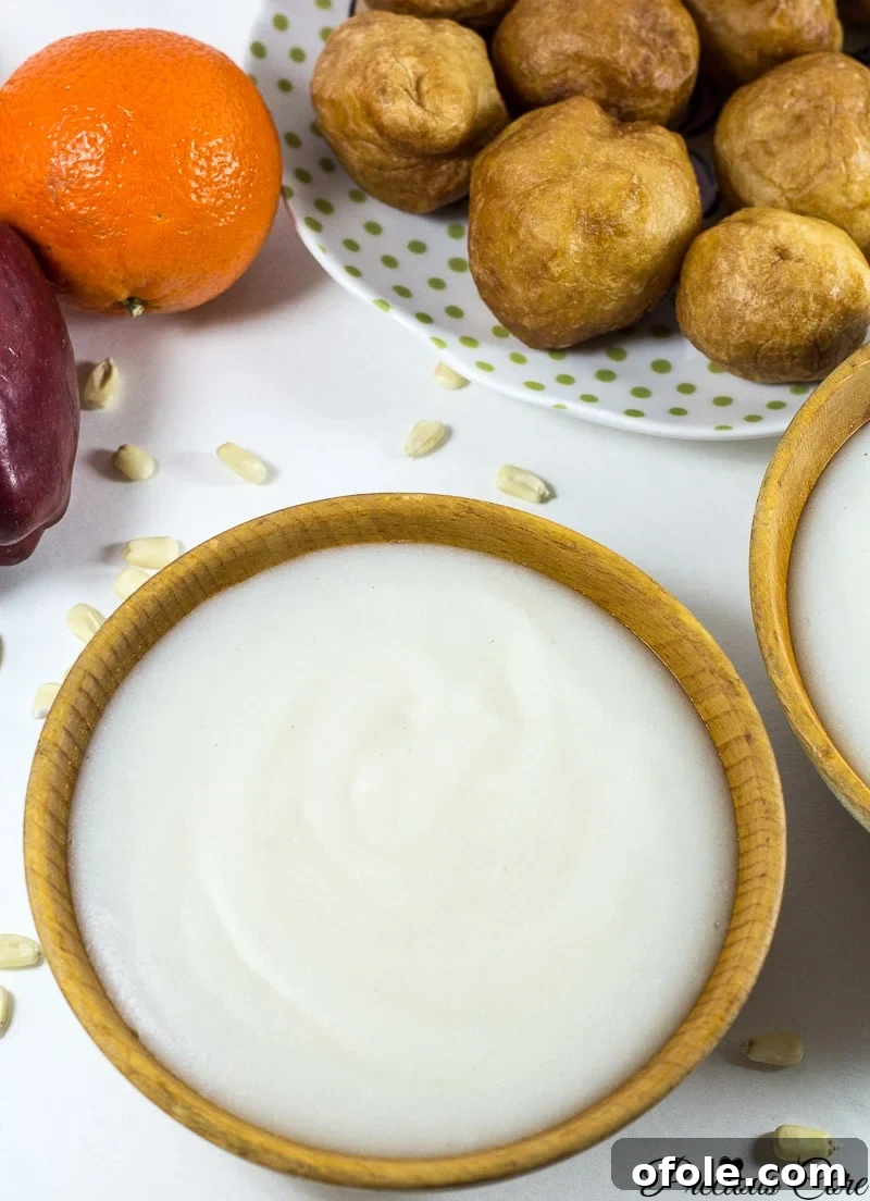 A heartwarming bowl of fermented corn porridge (Pap), garnished with evaporated milk, ideal for breakfast.