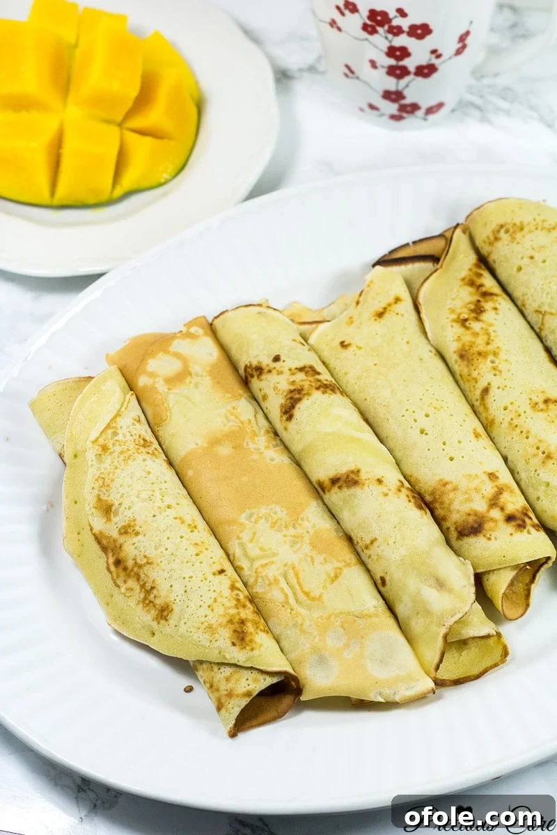 Cameroon's Delightful Savory Pancakes 3 Large plate of rolled Cameroonian pancakes.