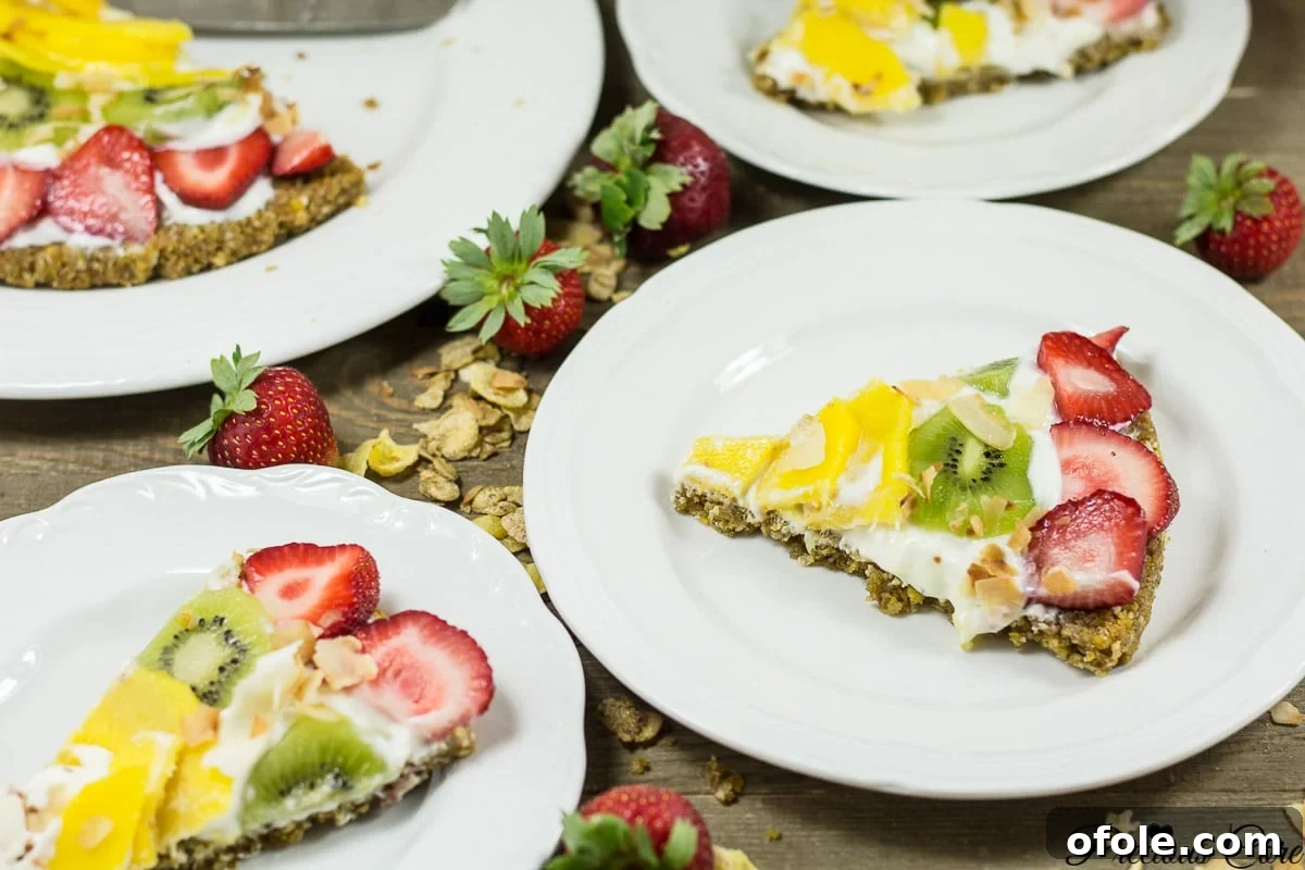 The Cereal-Crusted Breakfast Pizza 4 Slices of breakfast pizza on white plates.