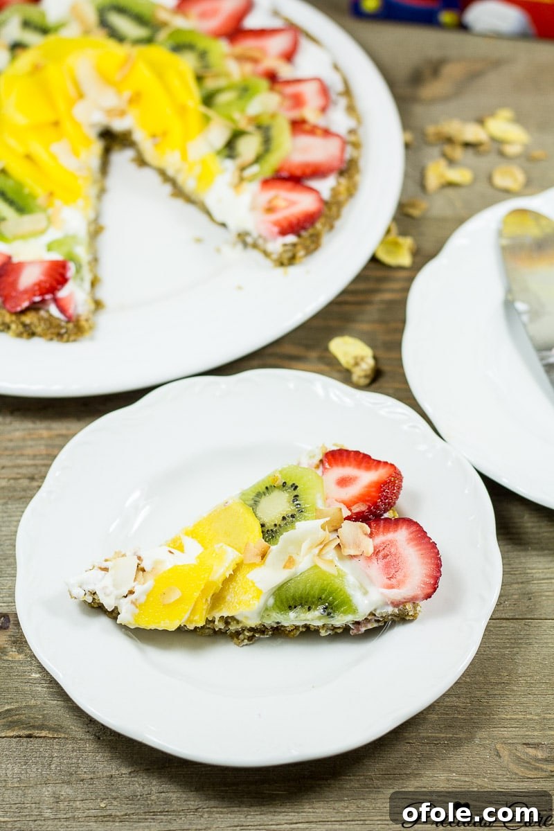 The Cereal-Crusted Breakfast Pizza 10 Slice of breakfast pizza with cereal crust on a white plate.