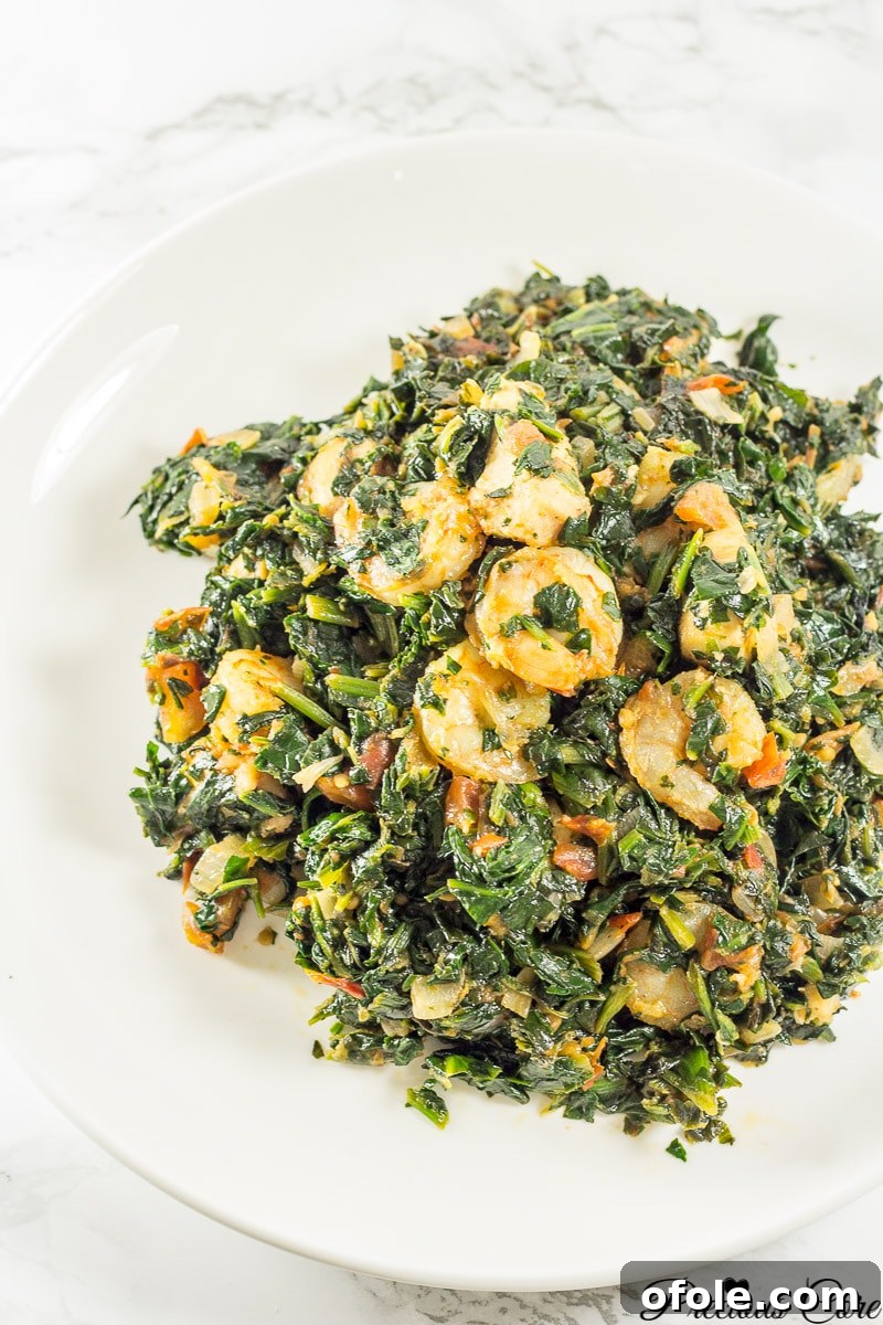 The Drive to Blog 3 spinach stew recipe - A bowl of vibrant spinach stew with fufu, a traditional African dish.