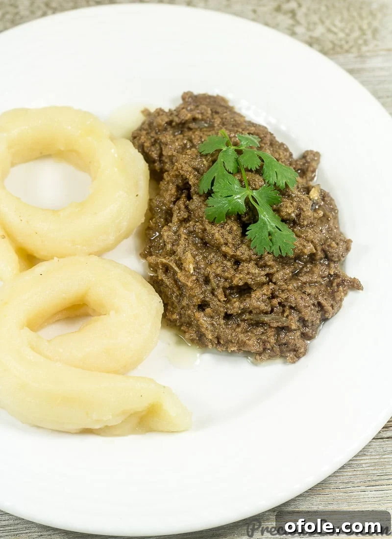 Mboh Groundnut Paste 7 A hearty serving of Cameroonian Bobolo alongside freshly made Mboh, illustrating a classic and delicious pairing.