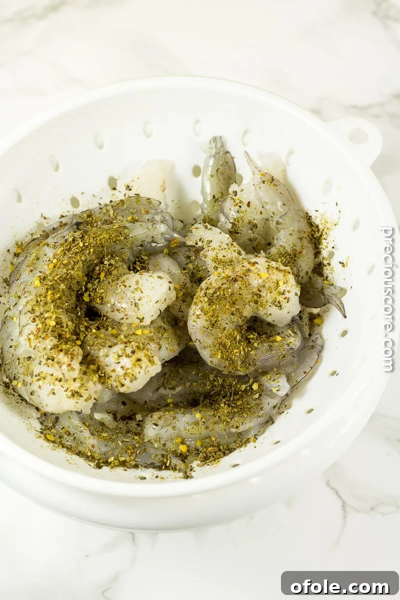 Shrimp being seasoned with McCormick All-Purpose Seasoning