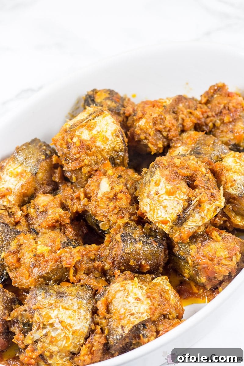 Sweet Chili Glazed Fish 5 Peppered Fish Recipe with rich red sauce coating the fish.