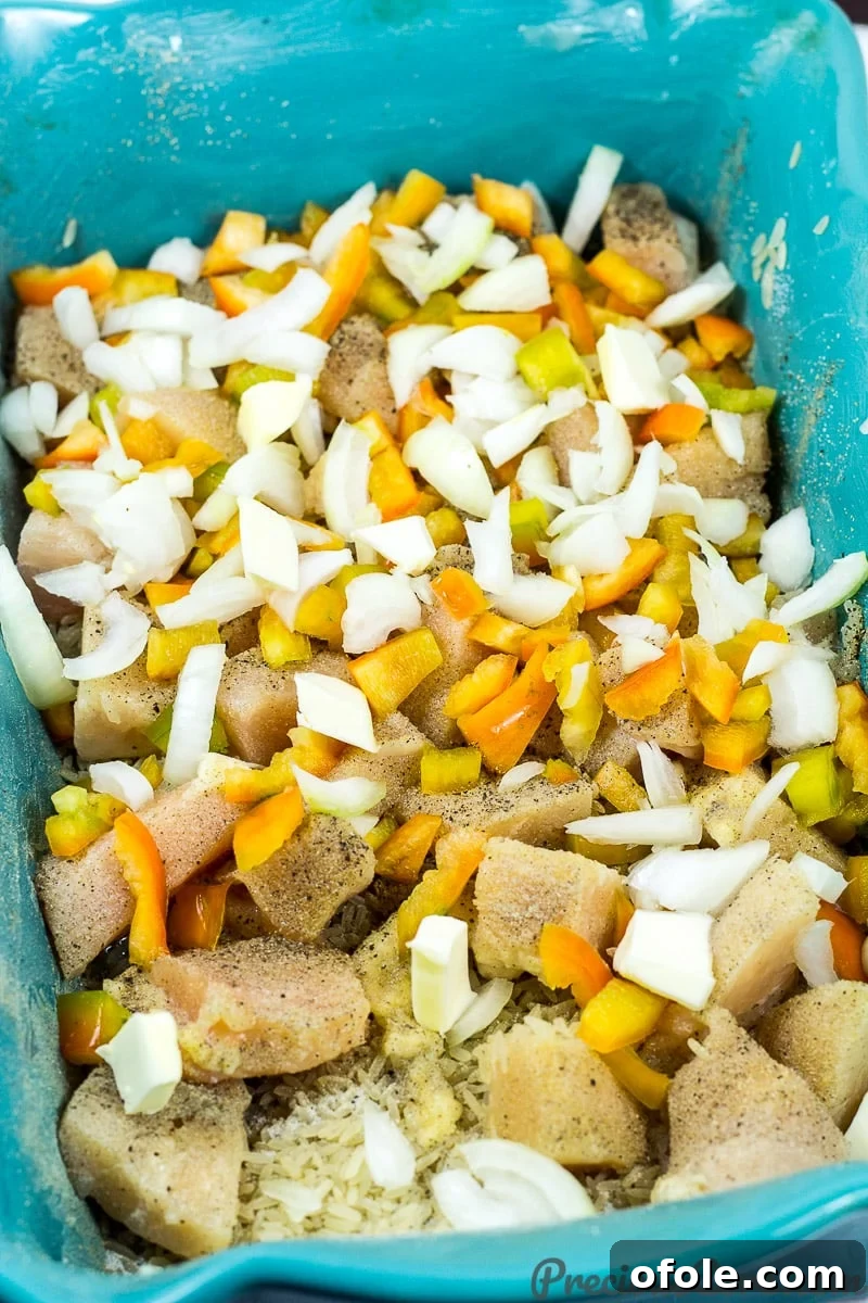 Adding ingredients to baking dish for Chicken and Rice Casserole