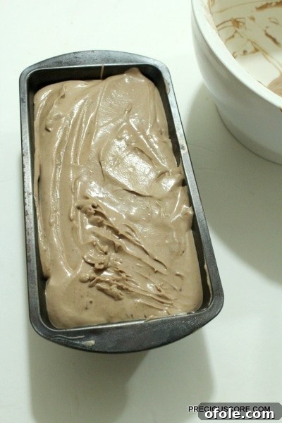 Effortless Chocolate Ice Cream Recipe 7 Pouring the chocolate ice cream mixture into a loaf pan