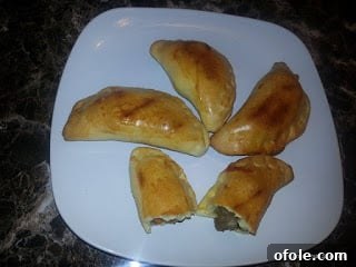 Rich African Meat Pies, golden brown pastry filled with savory meat