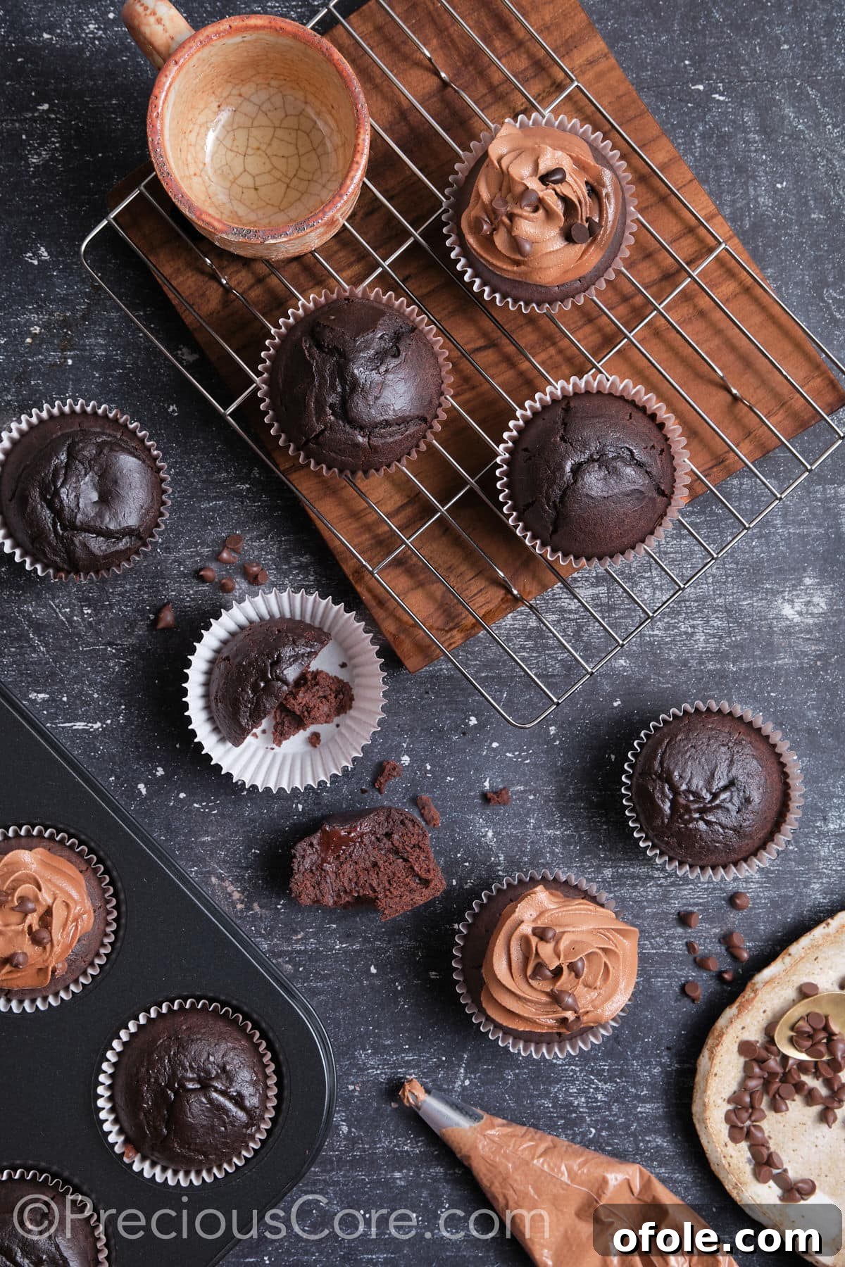 Decadent Chocolate Cupcakes 17 Applying rich chocolate frosting to easy moist chocolate cupcakes, showcasing the final decorative step.
