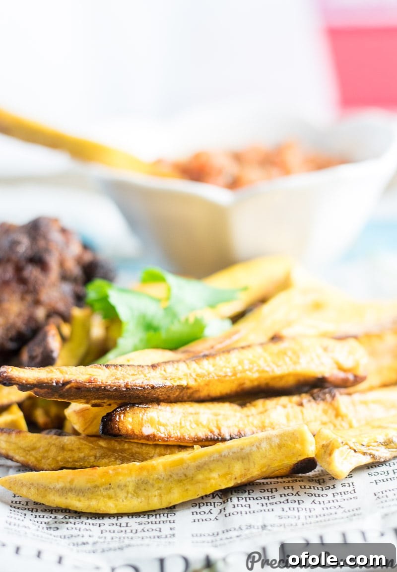 Plantain Fries 6 A close-up shot emphasizing the golden-brown texture of fries perfectly made from semi-ripe plantains, showing their crispiness.