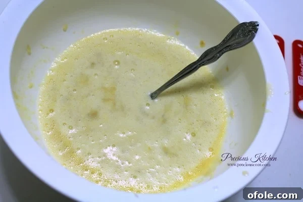 Mix Wet Ingredients Mixing wet ingredients for banana pancake batter