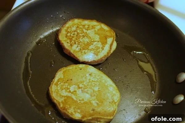 Flip Pancakes Flipping a cooking whole wheat banana pancake