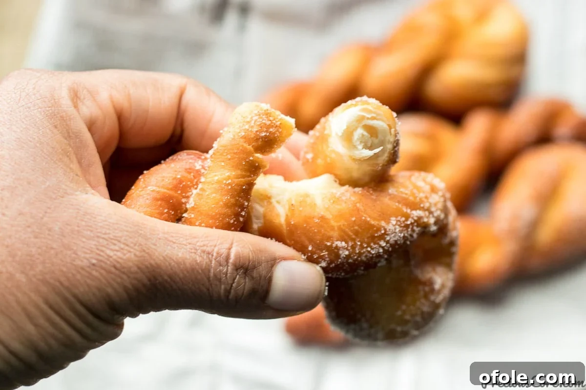 Close-up of perfectly golden African doughnuts, showcasing their fluffy texture.