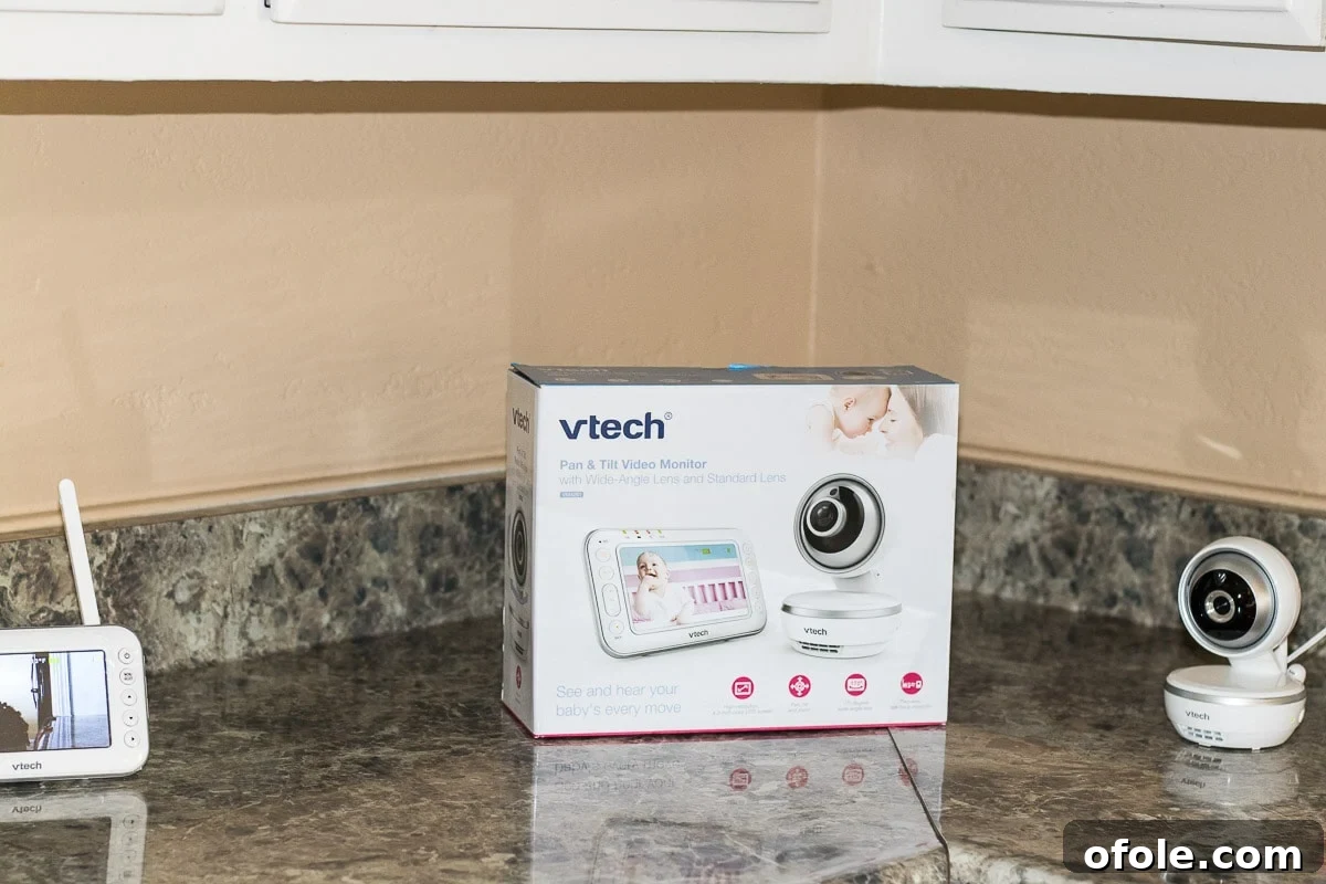 A VTech VM4261 baby monitor positioned in a nursery, part of a comprehensive preparing for baby checklist, highlighting modern baby tech.